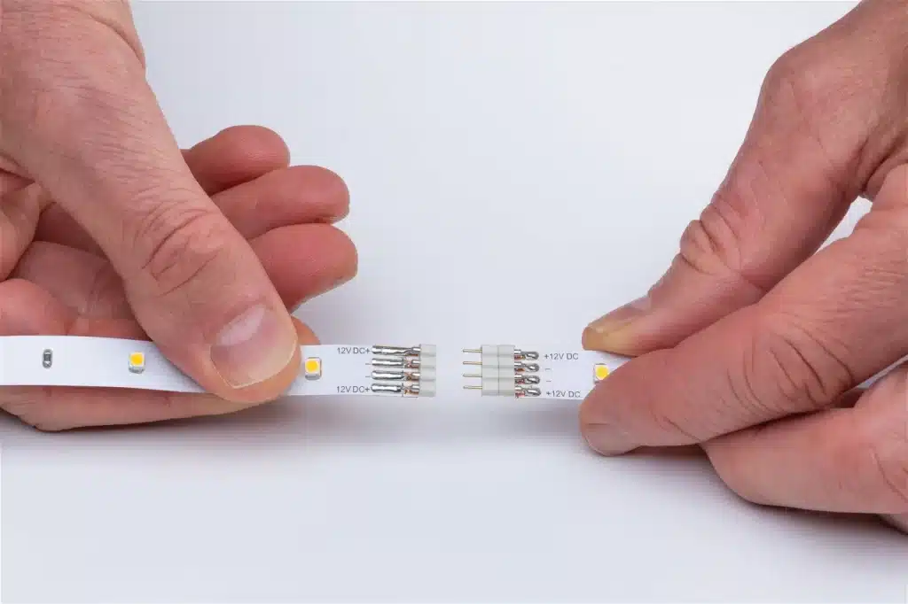 a person connecting led strips