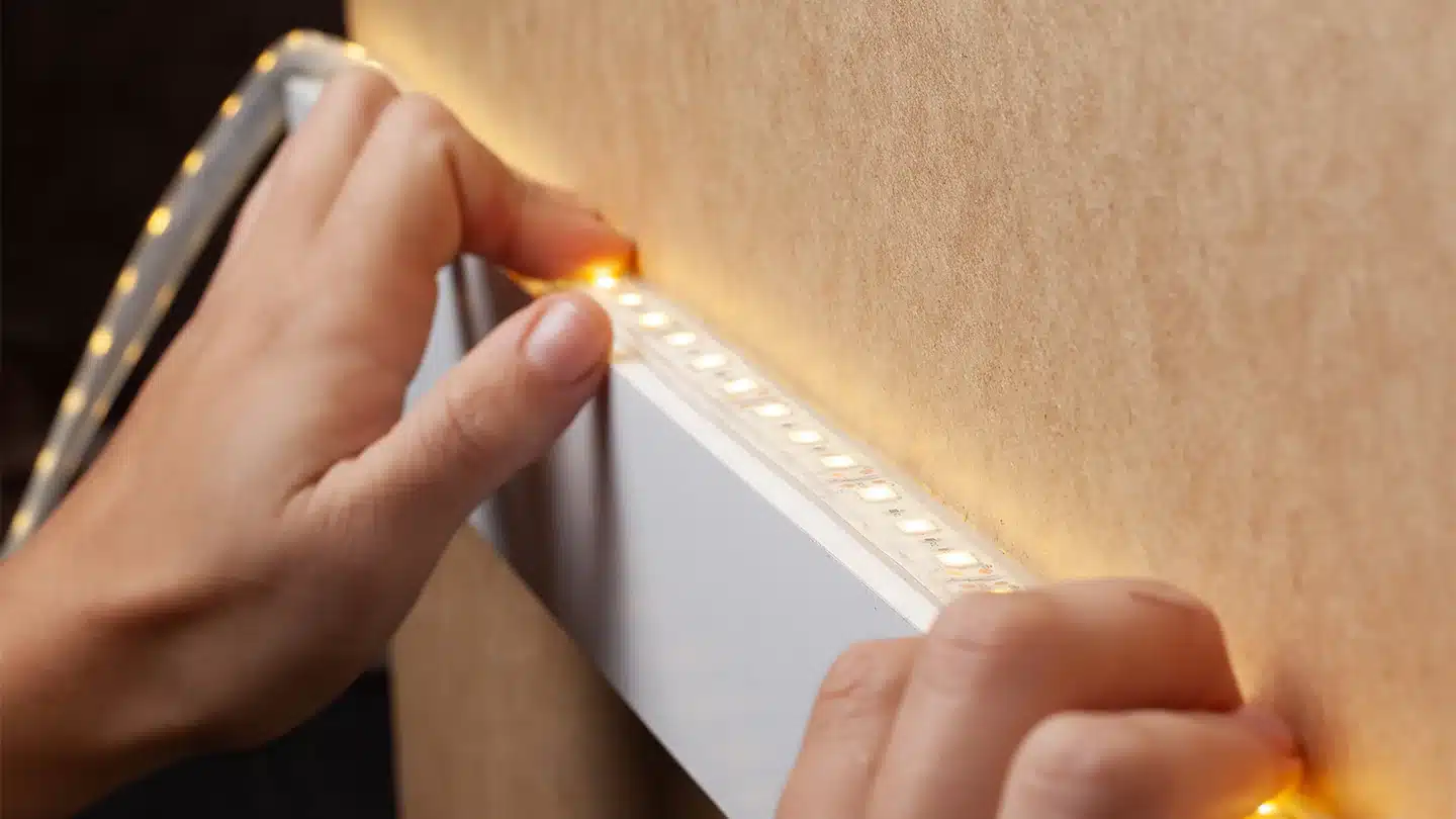 a person installing LED strip